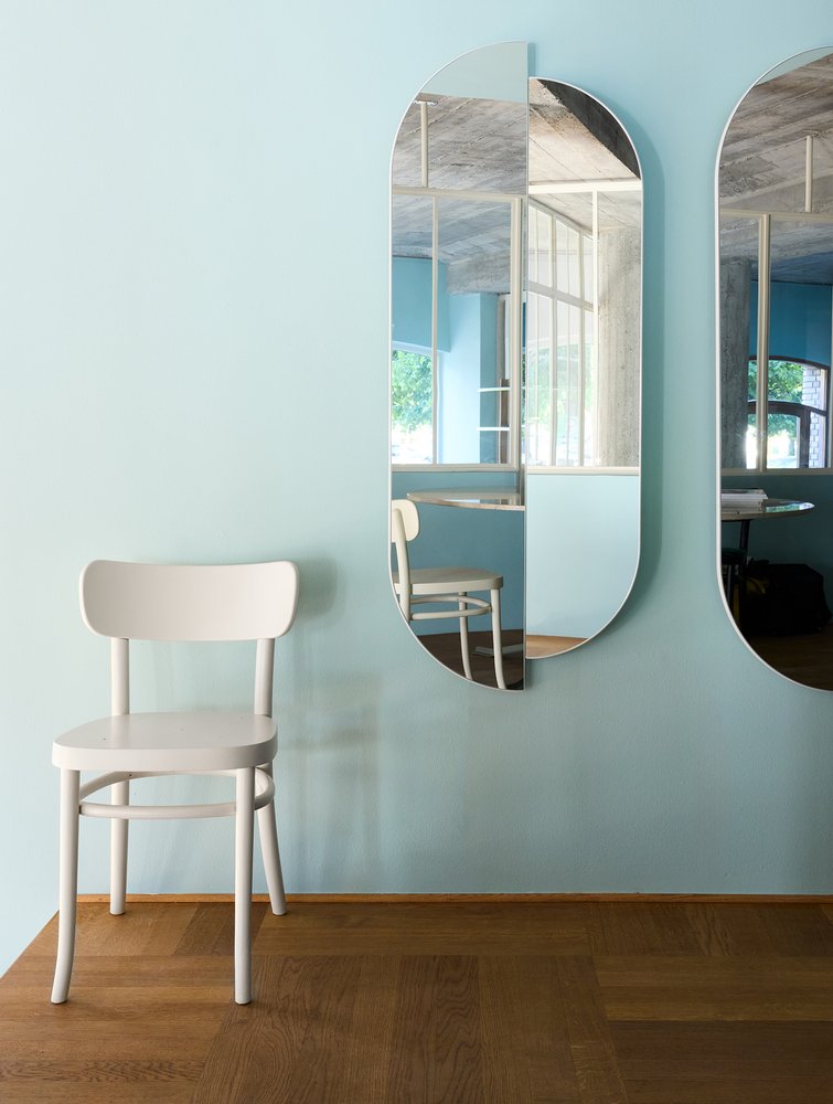 RAE Mirror Full Body pair on a light blue wall above a white wooden chair