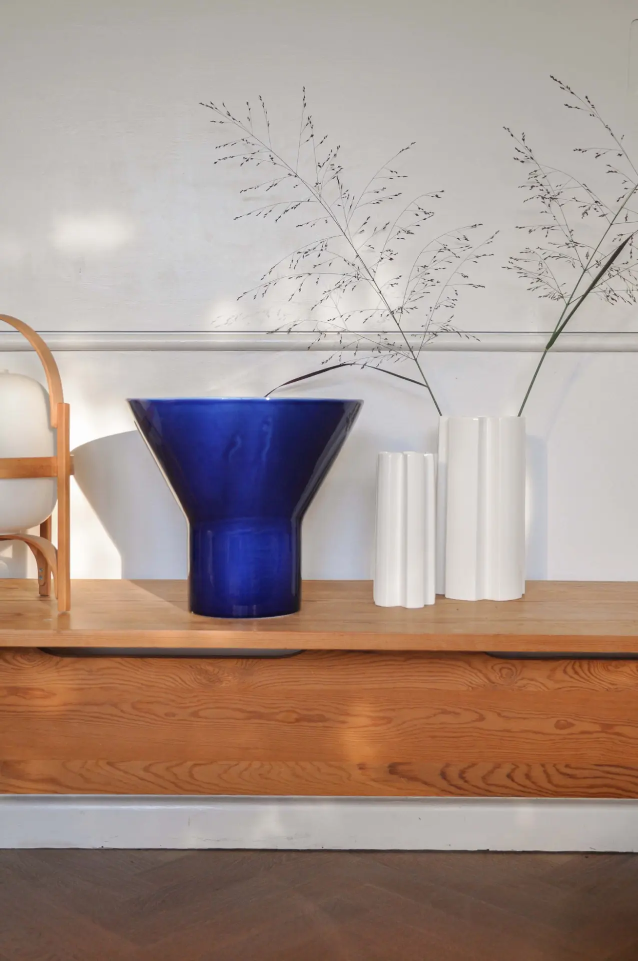 Blue KYO Vase Large styled with white KYO vases on a wooden sideboard