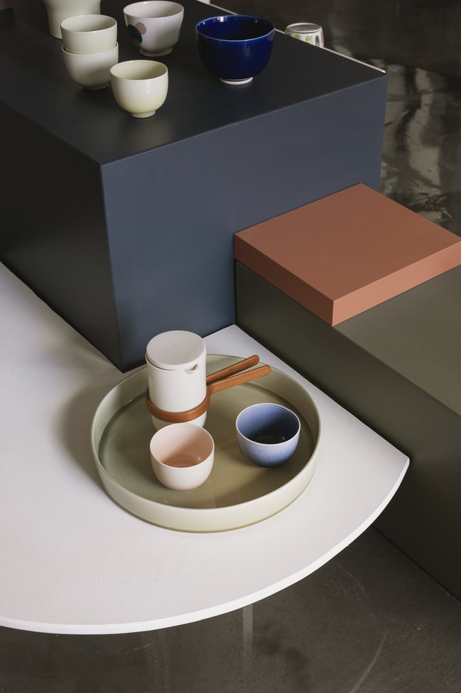 Mazo ceramics cups, teapot and tray styled on stepped showroom plinths
